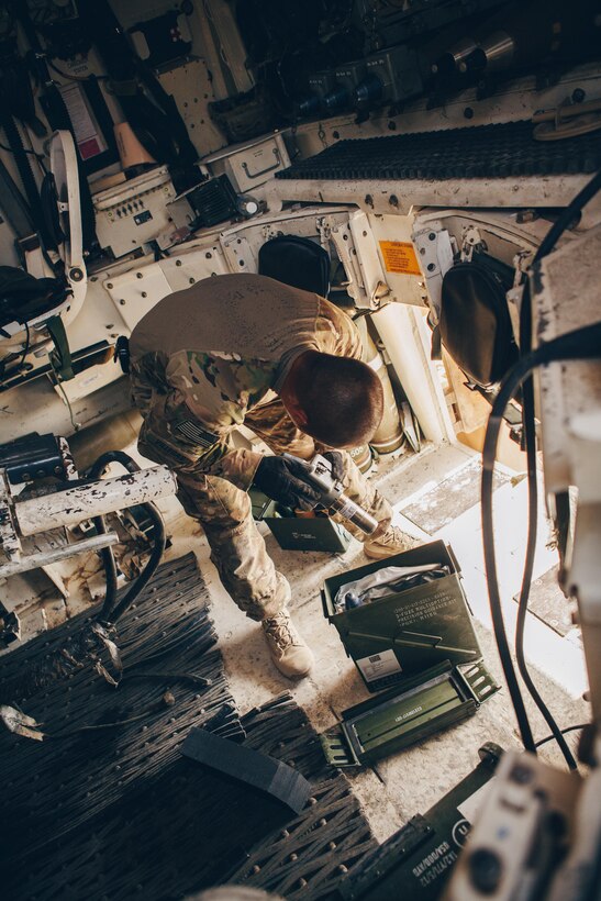 Army Staff Sgt. Salvador Villegas prepares fuses on artillery rounds for an M109A6 Paladin howitzer at Al-Taqaddum Air Base, Iraq, June 27, 2016, to support Operation Inherent Resolve. Villegas is a section chief assigned to Battery C, 4th Battalion, 1st Field Artillery Regiment, 1st Armored Division, Task Force Al Taqaddum. Marine Corps photo by Sgt. Donald Holbert