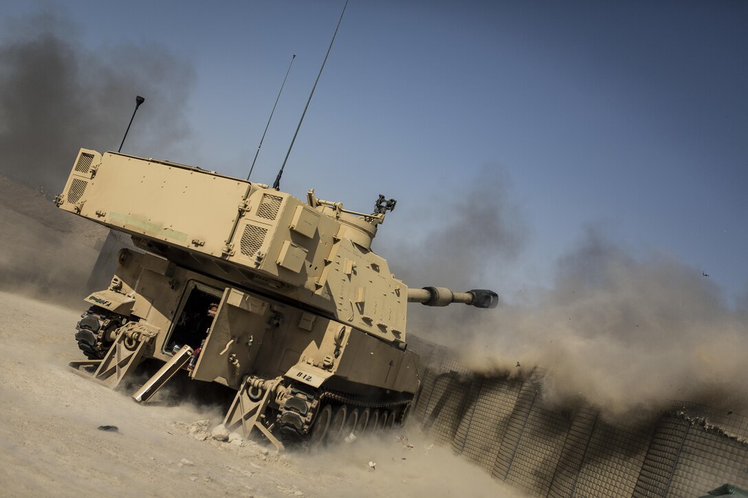 Soldiers fire an M109A6 Paladin howitzer during a fire mission at Al-Taqaddum Air Base, Iraq, June 27, 2016, to support Operation Inherent Resolve. Marine Corps photo by Sgt. Donald Holbert