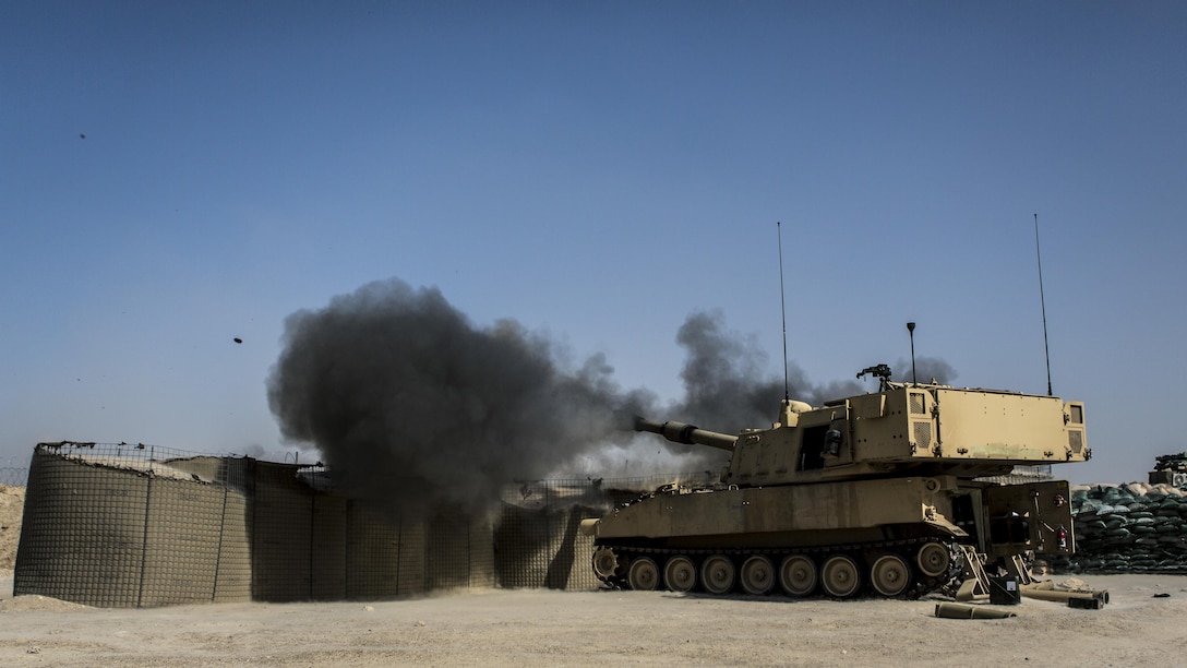 Soldiers fire an M109A6 Paladin howitzer during a fire mission at Al-Taqaddum Air Base, Iraq, June 27, 2016, to support Operation Inherent Resolve. Marine Corps photo by Sgt. Donald Holbert