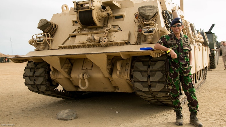 Assistant Chief of the Indonesian Navy for Operations, Rear Admiral I.N.G.N.Ary Atmaja, S.E., poses for a photo in front of a recovery vehicle during the USPACOM Amphibious Leaders Symposium on U.S. Marine Corps Base Camp Pendleton, Calif., July 13, 2016. PALS brings together senior leaders of allied and partner nations from the Indo-Asia Pacific region to discuss key aspects of maritime/amphibious operations, capability development, crisis response, and interoperability. Twenty-two allied and partnered nations, including the U.S. are participating. 
