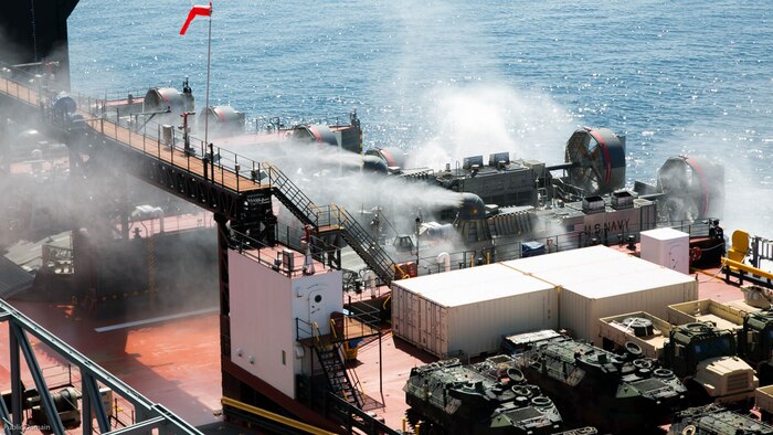Senior U.S. and foreign military leaders, not shown, observe a Landing Craft Air Cushion embark the USNS John Glenn during an amphibious assault demonstration during the USPACOM Amphibious Leaders Symposium at sea off the coast of U.S. Marine Corps Base Camp Pendleton, Calif., July 13, 2016. PALS brings together senior leaders of allied and partner nations from the Indo-Asia Pacific region to discuss key aspects of maritime/amphibious operations, capability development, crisis response, and interoperability. Twenty-two allied and partnered nations, including the U.S. are participating. 