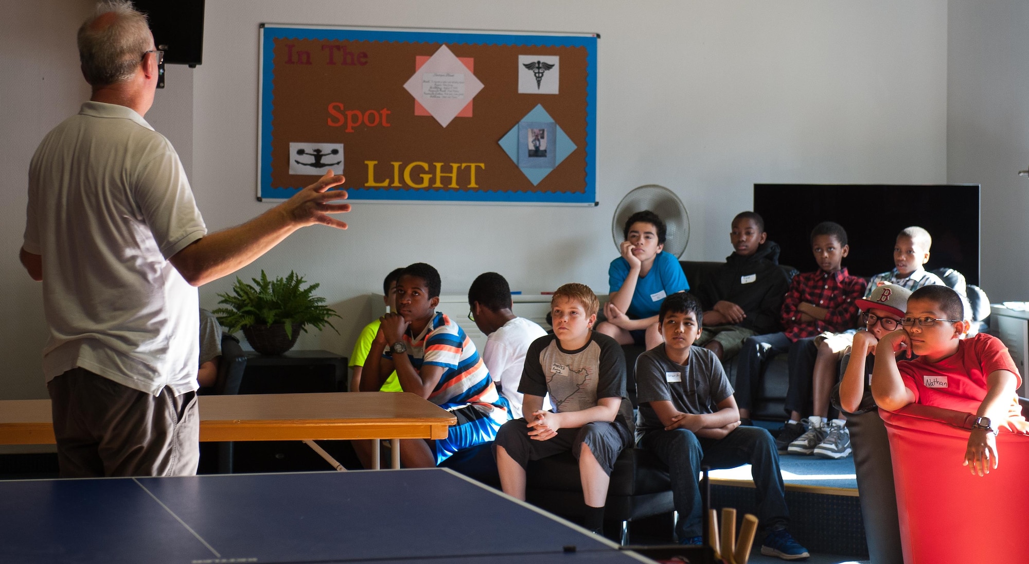 Burkhard Link, 86th Force Support Squadron Science, Technology, Engineering and Mathematics engineering instructor, talks to a group of kids during a STEM youth camp July 11, 2016, at Ramstein Air Base, Germany. The camp engaged children throughout the week with brain-stimulating activities such as completing construction projects, coding computer programs and experimenting with drones.