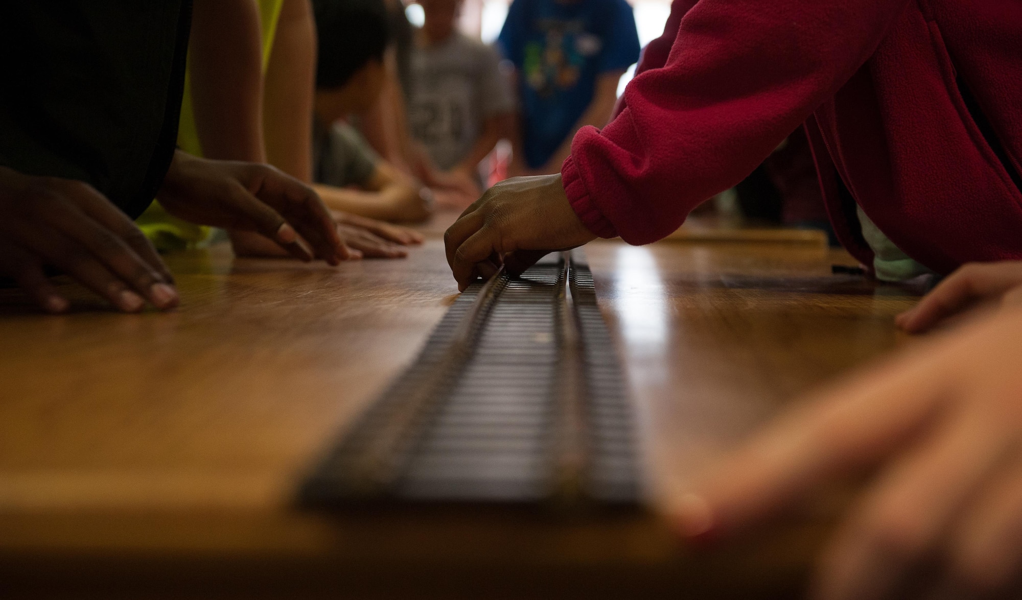 Children construct a toy railroad during a Science, Technology, Engineering and Mathematics youth camp July 11, 2016, at Ramstein Air Base, Germany. The youth camp encourages children of all ages to show off their creative sides by taking part in dozens of activities throughout the week that teach them essential skills, such as constructing, coding programs on a computer and more. 