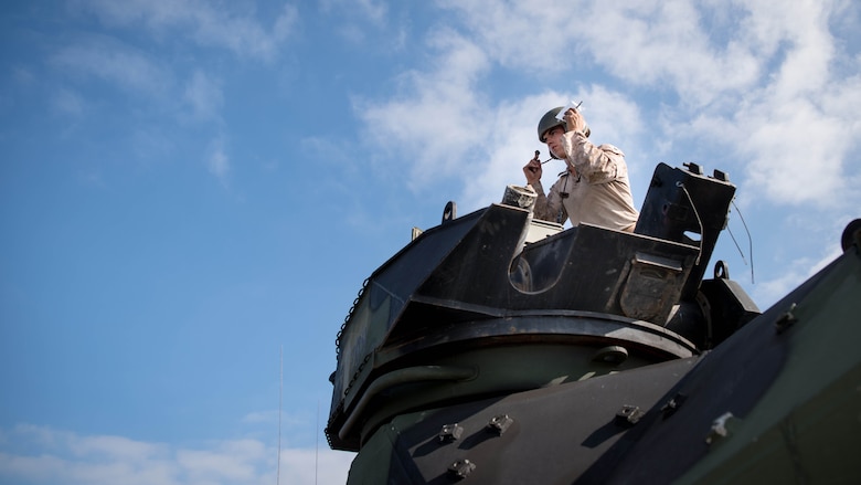 U.S. Marine Cpl. Jacob Ficenec, attached to Company B, 3rd Assault Amphibious Battalion, 1st Marine Division, does a communication check on an amphibious assault vehicle before getting underway from Naval Amphibious Base Coronado to participate in the Rim of the Pacific 2016 exercise. Twenty-six nations, more than 40 ships and submarines, more than 200 aircraft and 25,000 personnel are participating in RIMPAC from June 30 to Aug. 4, in and around the Hawaiian Islands and Southern California. 