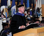 NIU President Dr. David Ellison, shown here welcoming new students at a recent convocation ceremony, announced plans to retire in August 2017 after the university completes its move to Bethesda. 