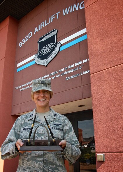 Great work for a job well done all year!  Capt. Elizabeth Wszalek, 932nd Force Support Squadron Manpower and Personnel Flight Chief, was named the 932nd Airlift Wing 2015 Company Grade Officer of the Year, but she was gone away, out of state to her military professional school during the actual annual awards ceremony.  The highly coveted pen and arch set, representing the "Gateway Wing Officer of the Year" award, finally caught up to her, and congratulations are in order from throughout the 932nd Airlift Wing for all the many moving parts of the wing that she assists with during the year.  (U.S. Air Force photo by Maj. Stan Paregien)