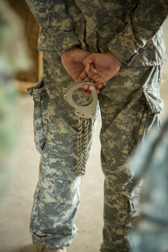 U.S. Army Soldiers from the 79th Military Police Company learn proper prisoner restraint techniques during Warrior Exercise (WAREX) 86-16-03 at Fort McCoy, Wis., July 12, 2016. WAREX is designed to keep soldiers all across the United States ready to deploy.
(U.S. Army photo by Spc. John Russell/Released)