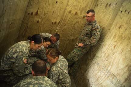 U.S. Marine Corps Gunnery Sgt. Timothy Hanson, Marine Corps Installations East Regional Brig, Camp Lejeune, Jacksonville, North Carolina, instructs U.S. Army Soldiers from the 79th Military Police Company on detainee extraction procedures during Warrior Exercise (WAREX) 86-16-03 at Fort McCoy, Wis., July 12, 2016. WAREX is designed to keep soldiers all across the United States ready to deploy.
(U.S. Army photo by Spc. John Russell/Released)