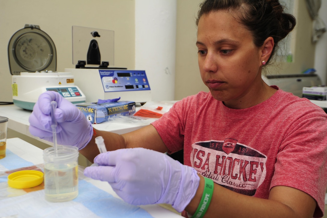 Air Force Staff Sgt. Christina Swope, part of a team conducting a public health investigation of the Zika virus disease among Exercise New Horizons personnel, prepares urine samples for testing in Rio San Juan, Dominican Republic, June 7, 2016.  Swope is a U.S. Air Force School of Aerospace Medicine lab technician. Air Force photo by Master Sgt. Chenzira Mallory
