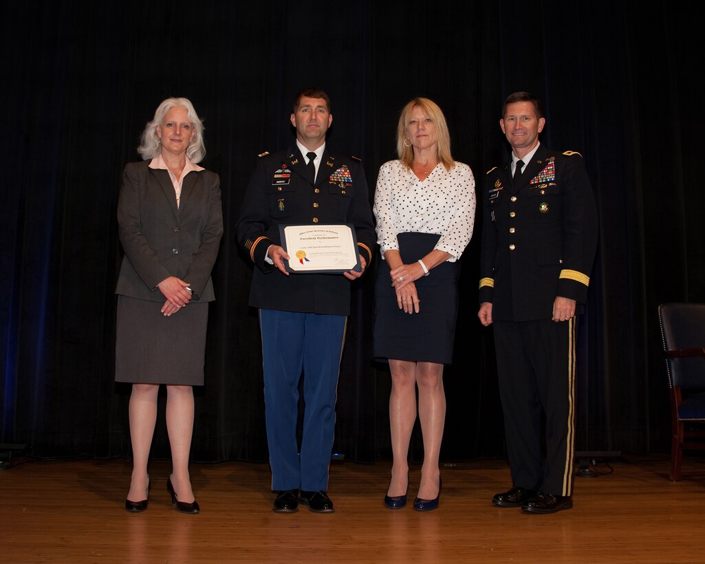 (Left to right)Acting Deputy Assistant Secretary of Defense for Systems Engineering Kristen Baldwin, Lt. Col. Stephen F. Murphy, Nashville District commander, Paula Coleman, value engineering officer in the Nashville District’s Engineering and Construction Division and Maj. Gen. Donald E. Jackson Jr., U.S. Army Corps of Engineers deputy commanding general for Civil and Emergency Operations.  Baldwin presented the 2015 Department of Defense Value Engineering Award during a ceremony at the Pentagon June 28, 2016. 

