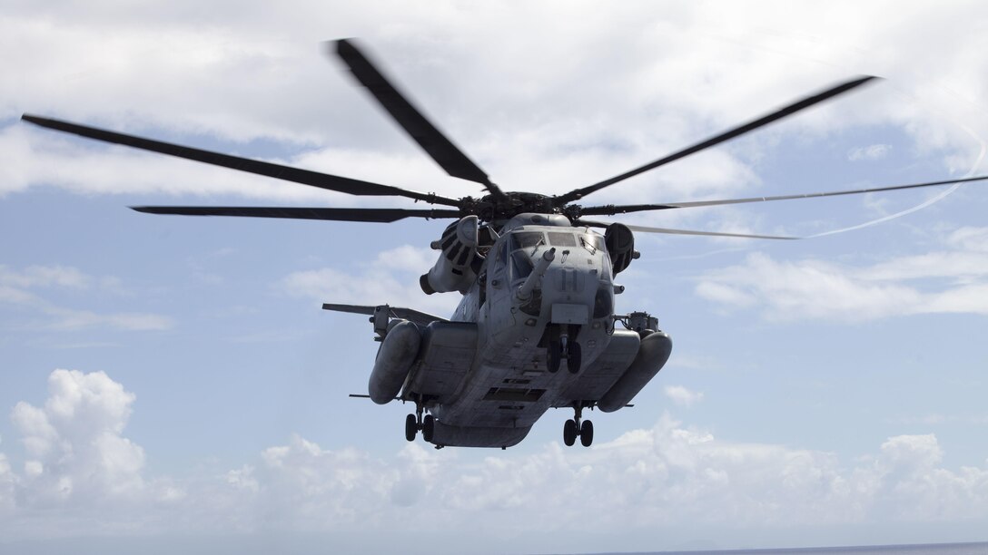 A Super Stallion CH-53E helicopter takes off from the USS America, July 12, 2016 during deck landing qualifications and initial arrival. Marine Heavy Helicopter Squadron 463 (reinforced) will operate the aircraft from the USS America as the Aviation Combat Element for Provisional Marine Expeditionary Brigade-Hawaii during RIMPAC. Twenty-six nations, 49 ships, six submarines, about 200 aircraft, and 25,000 personnel are participating in RIMPAC 2016 from June 29 to Aug. 4 in and around the Hawaiian Islands and southern California. The world's largest international maritime exercise, RIMPAC provides a unique training opportunity while fostering and sustaining cooperative relationships participants critical to ensuring the safety of sea lanes and security on the world's oceans. 