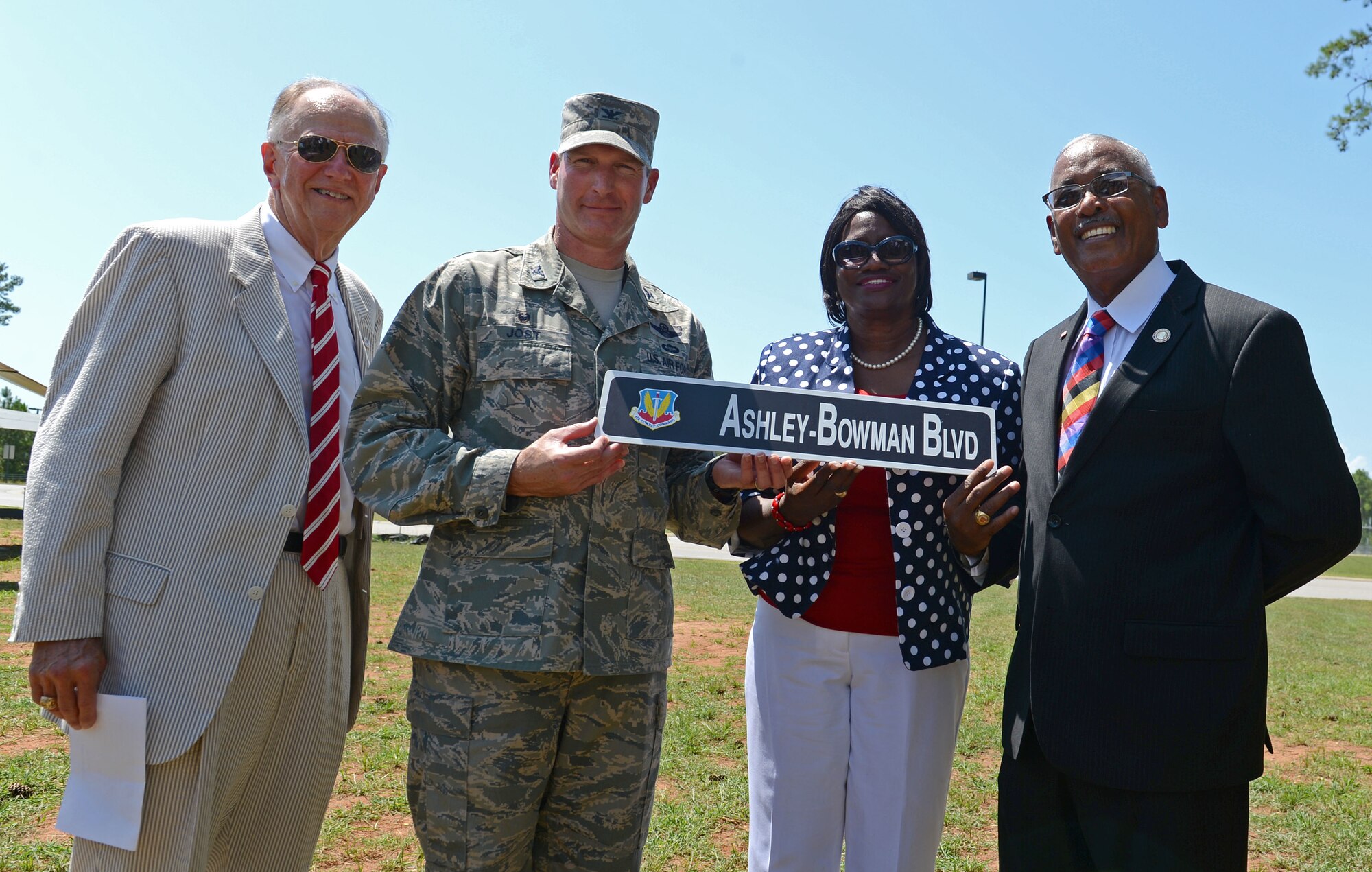 (From left) Mayor Joseph McElveen, City of Sumter mayor, U.S. Air Force Col. Stephen Jost, 20th Fighter Wing commander, Vivian McGhaney, chair of Sumter County Council, and Rev. Ralph Canty, step-brother of U.S. Army Air Corps 1st Lt. Leroy Bowman, hold a street sign during a street renaming ceremony at Shaw Air Force Base, S.C., July 14, 2016. The ceremony was held in honor of Bowman, who passed away in 2014, and Lt. Col. Willie Ashley, who passed away in 1984, both of whom were Tuskegee Airmen and City of Sumter natives. (U.S. Air Force photo by Airman 1st Class Christopher Maldonado) 