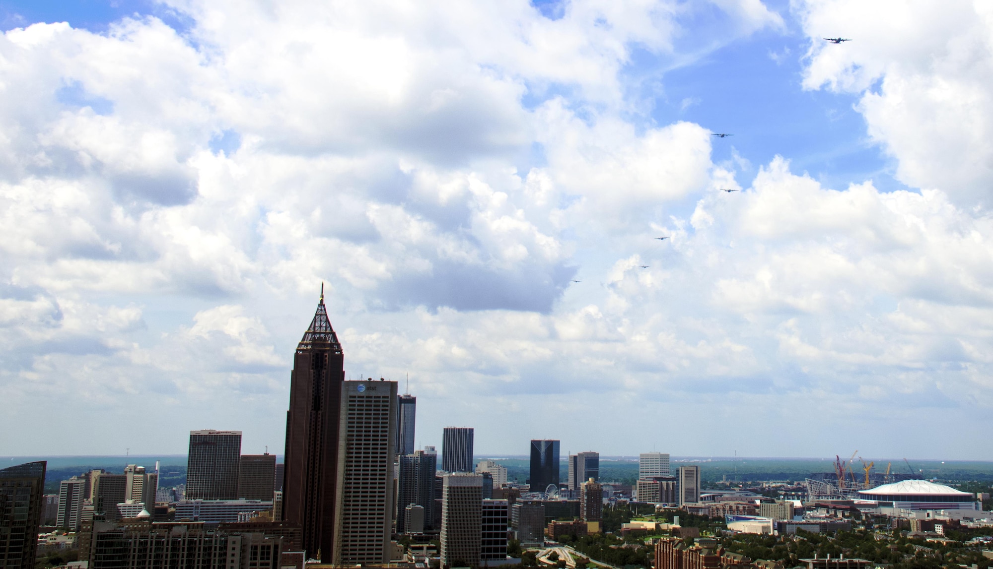 A six-ship C-130 Hercules formation from Dobbins Air Reserve Base, Ga., flies over downtown Atlanta on July 9, 2016. The 94th Airlift Wing conducted proficiency training missions over downtown Atlanta and much of the metro area. (U.S. Air Force photo/Staff Sgt. Daniel Phelps)
