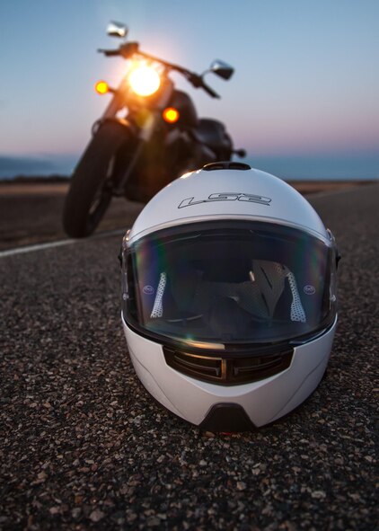A motorcycle helmet rests on the side of the road in Minot, N.D., April 9, 2016. During the summer, a great way to enjoy the area is to start up the motorcycle and hit the road. (U.S. Air Force photo/J.T. Armstrong)