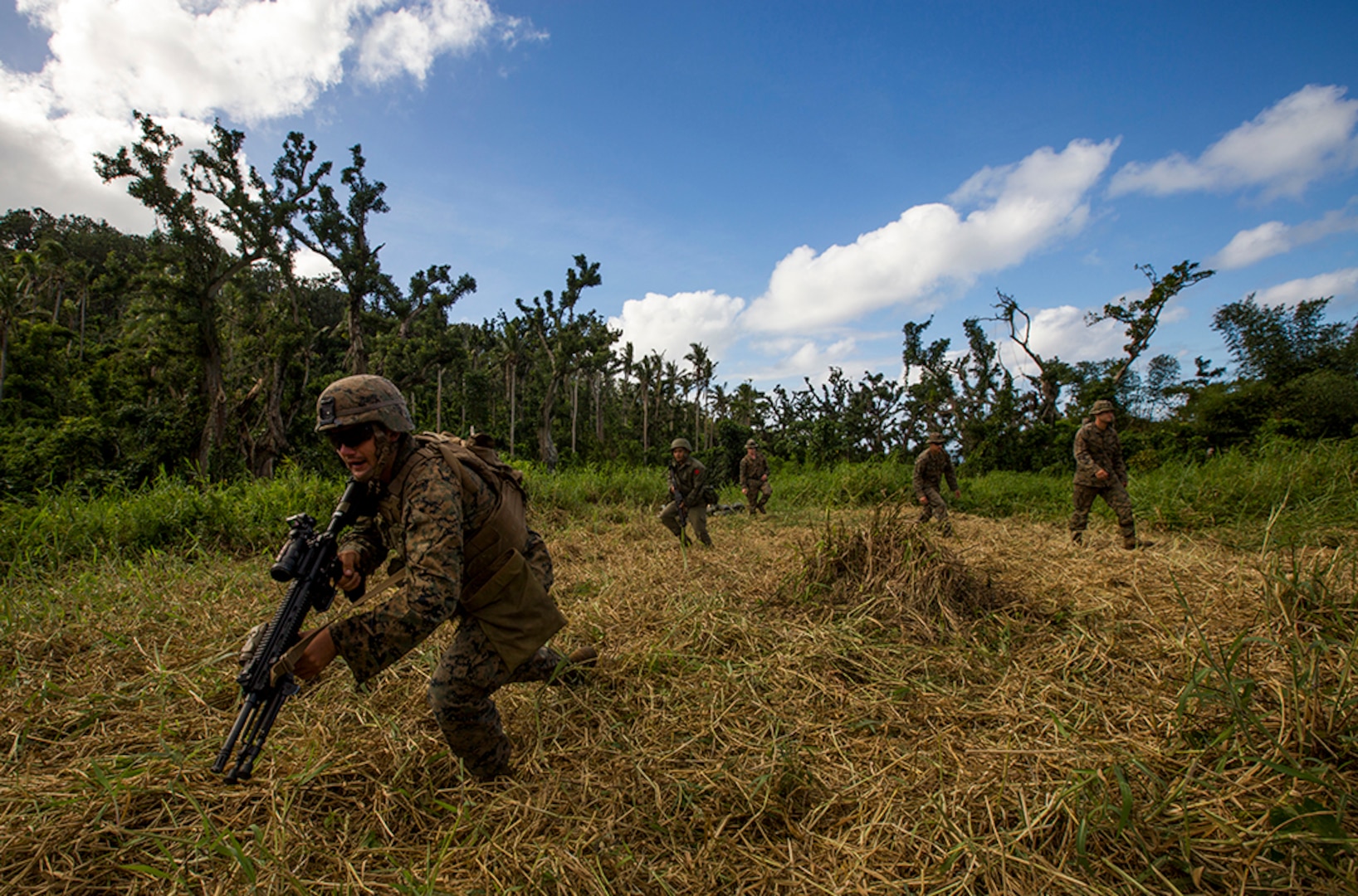 U.S. Marines with Task Force Koa Moana 16.2 and Soldiers from the Republic of Fiji Military Forces conduct integrated fire-team buddy rushes on Ovalau, Fiji, July 13, 2016. Fiji is part of Task Force Koa Moana’s deployment throughout the Asia-Pacific region, where Marines and Sailors will share engineering and infantry skills with the Republic of Fiji Military Forces to strengthen mil-to-mil relationships and interoperability. 