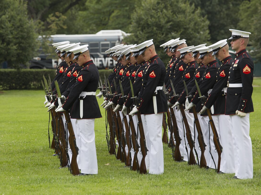 The United States Marine Corps Silent Drill Platoon, Marine Barracks Washington, D.C., performs for Honor Flight Chicago veterans at the Marine Corps War Memorial, Arlington, Va., July 13, 2016. Honor Flight Chicago is a non-profit organization created to recognize World War II, Korean War and Vietnam War Chicago veterans for their service by flying them all-expense-paid to Washington, D.C. for a day of honor, remembrance and celebration. (Official Marine Corps photo by Lance Cpl. Robert Knapp/Released)