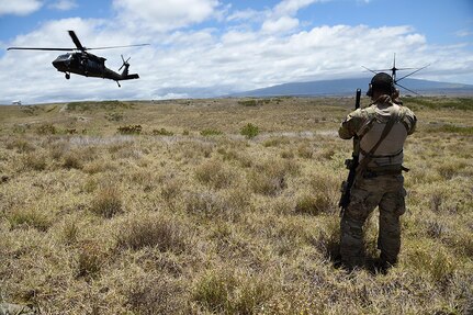 BRADSHAW ARMY AIRFIELD, Hawaii  (July 10, 2016) - An Air Force combat controller from the 320th Special Tactics Squadron uses a satellite communication antenna to coordinate with the operations center during a humanitarian assistance and disaster response scenario as part of Rim of the Pacific(RIMPAC) 2016, Pohakuloa Training Area.  Twenty-six nations, more than 40 ships and submarines, more than 200 aircraft and 25,000 personnel are participating in RIMPAC from June 30 to Aug. 4. RIMPAC provides a unique training opportunity that helps participants foster and sustain the cooperative relationships that