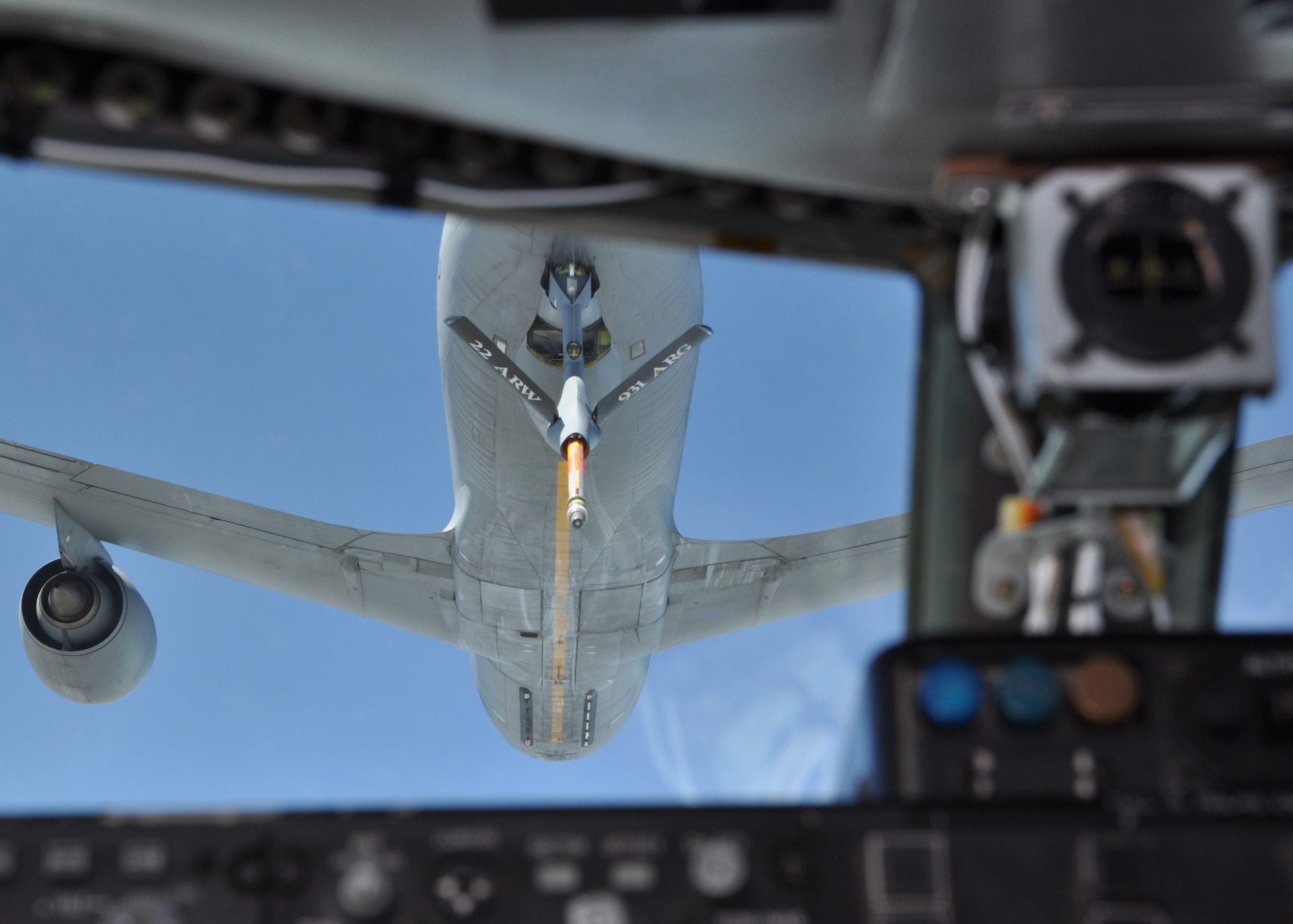A Team McConnell boom operator extends a boom to connect to an approaching KC-135 Stratotanker during a Receiver/Tanker training flight July 13, 2016, McConnell Air Force Base, Kan. During the process, the receiving pilot must manually fly close enough to the offloading tanker to connect with the boom. (U.S. Air Force photo by Senior Airman Preston Webb)