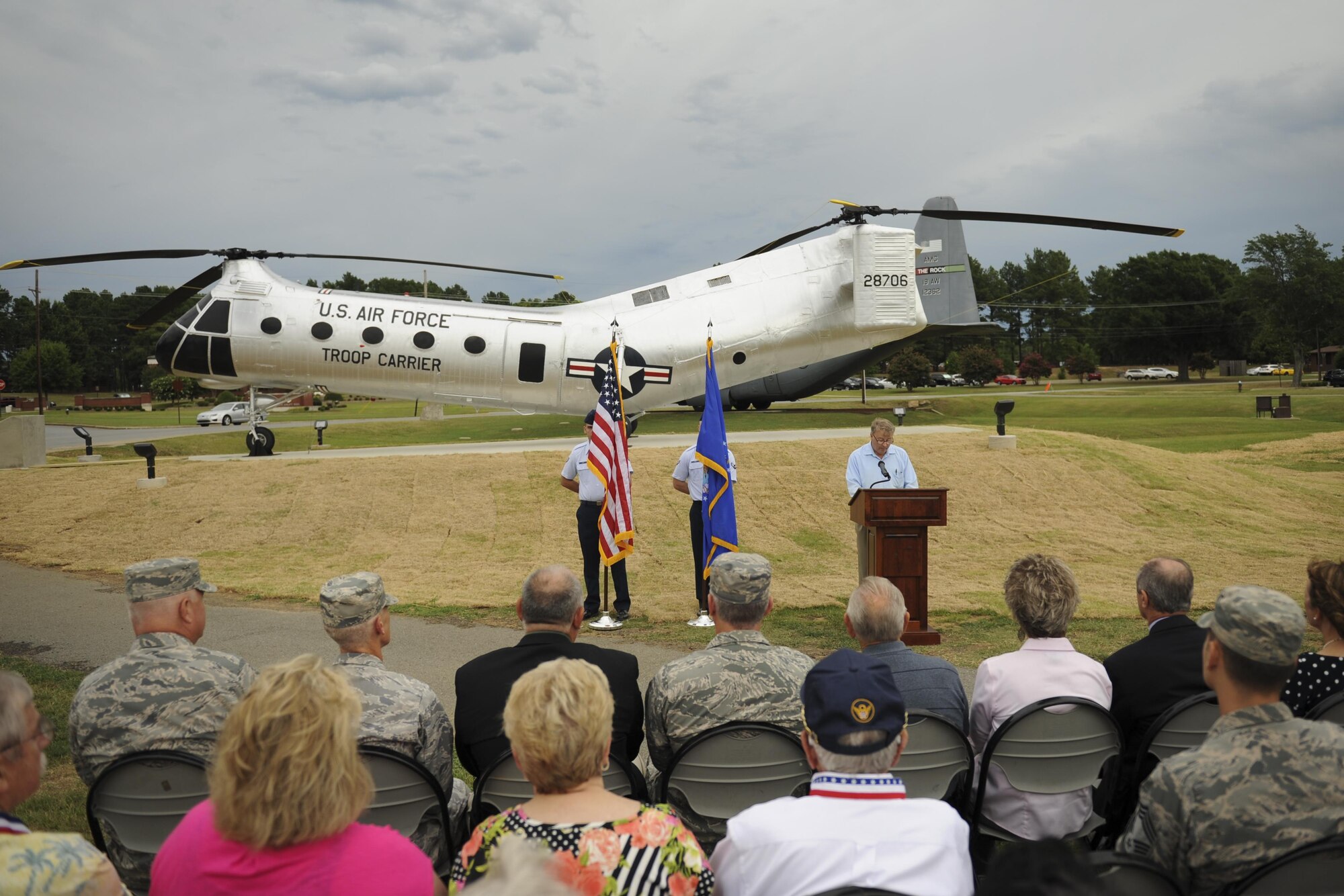 Mark Wilderman, 314th Airlift Wing historian, explains the heritage of the H-21B to a group of Airmen and civic leaders July 14, 2016, at Little Rock Air Force Base, Ark. The H-21B is the newest static display aircraft to enter into the Little Rock AFB fleet at Heritage Park. (U.S. Air Force photo/Senior Airman Harry Brexel)