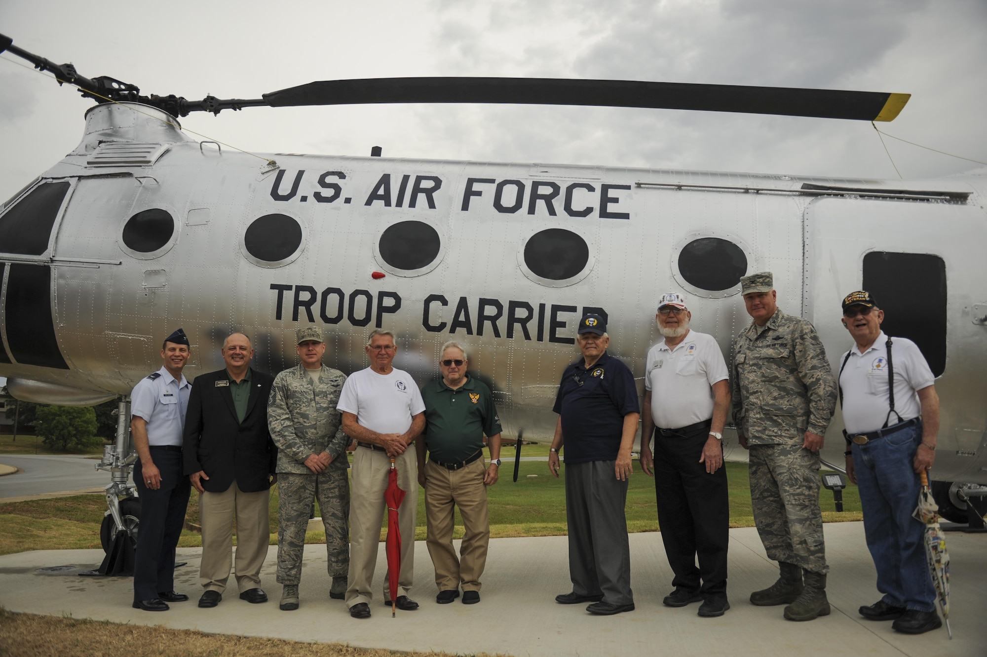 U.S. Air Force veterans and Team Little Rock leaders commemorate the H-21B helicopter static display July 14, 2016, at Little Rock Air Force Base, Ark. The assault helicopter was originally delivered to the Air Force in 1955 and was known as a tactical airlift workhouse. (U.S. Air Force photo/Senior Airman Harry Brexel)