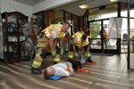 902nd Civil Engineer fire department personnel provide treatment to a simulated victim during an active shooter exercise at Joint Base San Antonio-Randolph July 12. The active shooter exercise tested the threat response time and effectiveness of Joint Base San Antonio’s emergency responders and support agencies. The exercise replicated possible real-world events and was designed to enhance training and readiness of JBSA emergency responders during threats to the installation and units.