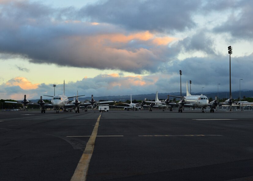 U.S. Navy P-3C Orion aircraft from Marine Corps Air Station Kaneohe Bay, Hawaii site on the flightline of Joint Base Pearl Harbor-Hickam during the Rim of the Pacific Exercises 11 June, 2016. Twenty-six nations, 49 ships, six submarines, about 200 aircraft, and 25,000 personnel are participating in Rim of the Pacific 2016 from June 29 to Aug. 4 in and around the Hawaiian Islands and Southern California. The world’s largest international maritime exercise, RIMPAC provides a unique training opportunity while fostering and sustaining cooperative relationships between participants critical to ensuring the safety of sea lanes and security on the world’s oceans. RIMPAC 16 is the 25th exercise in the series that began in 1971. (U.S. Air Force photo by Tech. Sgt. Aaron Oelrich) 

