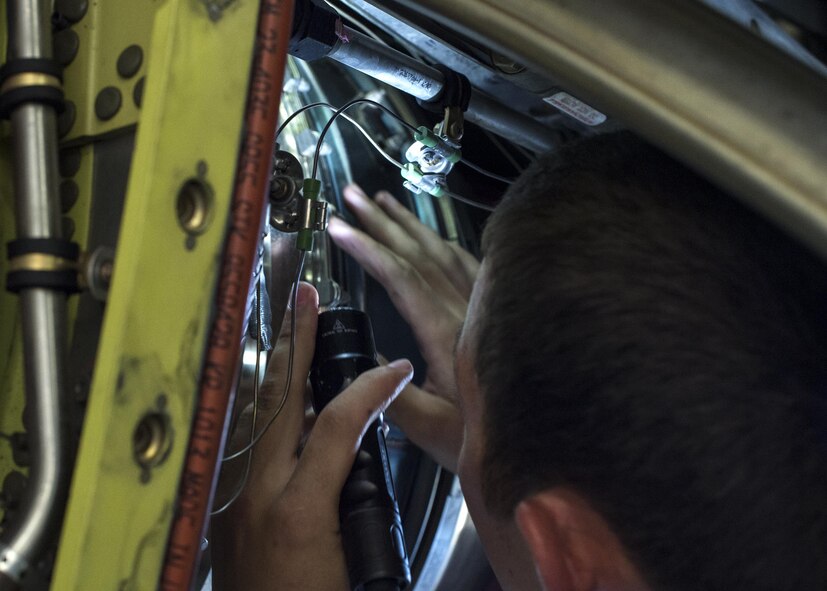 U.S. Air Force Staff Sgt. Richard Adcock, 23d Maintenance Group quality assurance inspector, performs a zonal inspection on an HC-130J Combat King II, July 7, 2016, at Moody Air Force Base, Ga. A zonal inspection is accomplished when an aircraft is divided into zones for various inspectors to check. (U.S. Air Force photo by Airman 1st Class Janiqua P. Robinson)