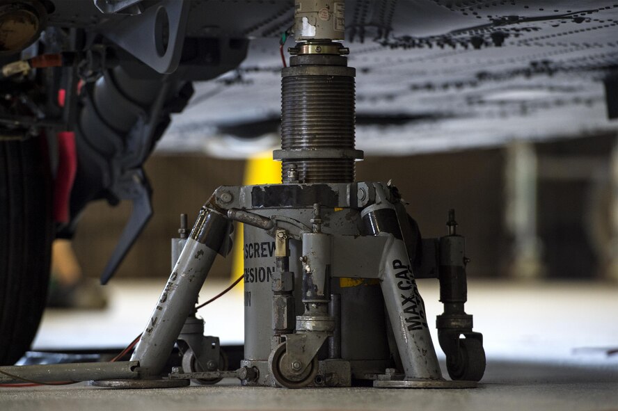 A helicopter jack stand sits under an HH-60G Pave Hawk helicopter, July 7, 2016, at Moody Air Force Base, Ga. Quality assurance inspectors make sure U.S. Air Force Airmen assigned to the 41st Helicopter Maintenance Unit perform maintenance in the correct order and properly. (U.S. Air Force photo by Airman 1st Class Janiqua P. Robinson)