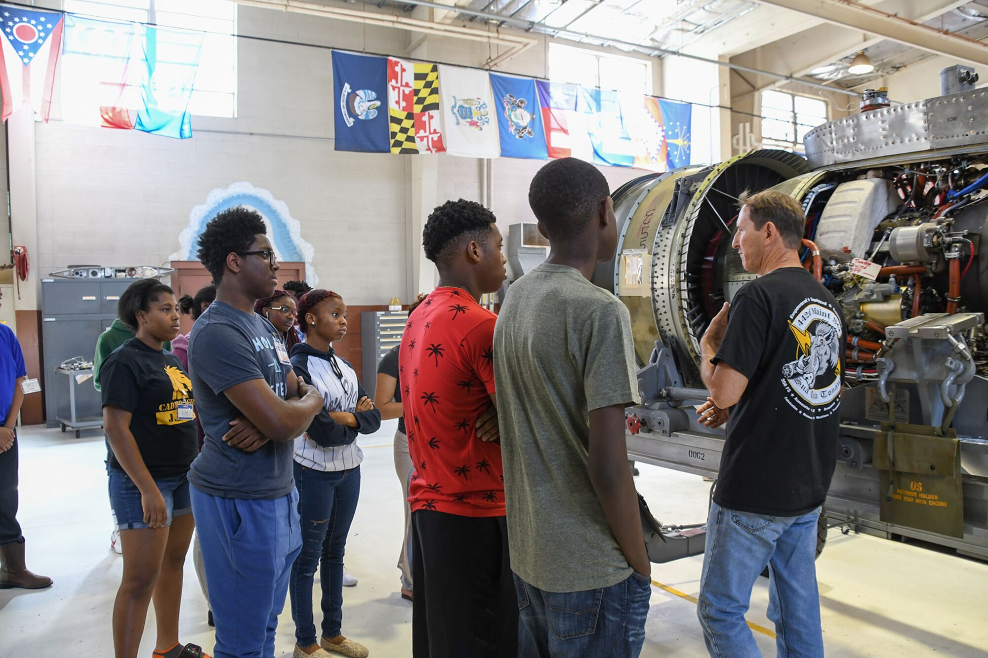 U.S. Air Force Master Sgt. William George, assigned to the 442nd Maintenance Squadron, shows high school students a rebuilt jet engine from an A-10 Thunderbolt on July 13, 2016. The students are receiving a tour of the maintenance sections on Barksdale Air Force Base, La. while attending the Aviation Maintenance Summer Camp offered by Southern University at Shreveport.  (U.S. Air Force photo by Master Sgt. Dachelle Melville/Released)