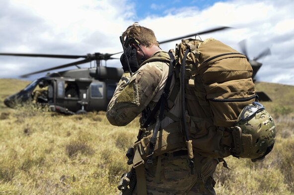 An Air Force combat controller with the 320th Special Tactics Squadron coordinates with a UH-60 Blackhawk for take off during a humanitarian assistance and disaster response scenario as part of Rim of the Pacific (RIMPAC) 2016, Pohakuloa Training Area, Hawaii, July 10, 2016. Twenty-six nations, more than 40 ships and submarines, more than 200 aircraft and 25,000 personnel are participating in RIMPAC from June 30 to Aug. 4, in and around the Hawaiian Islands and Southern California. The world's largest international maritime exercise, RIMPAC provides a unique training opportunity that helps participants foster and sustain the cooperative relationships that are critical to ensuring the safety of sea lanes and security on the world's oceans. RIMPAC 2016 is the 25th exercise in the series that began in 1971.(U.S. Air Force photo by 2nd Lt. Jaclyn Pienkowski/Released)