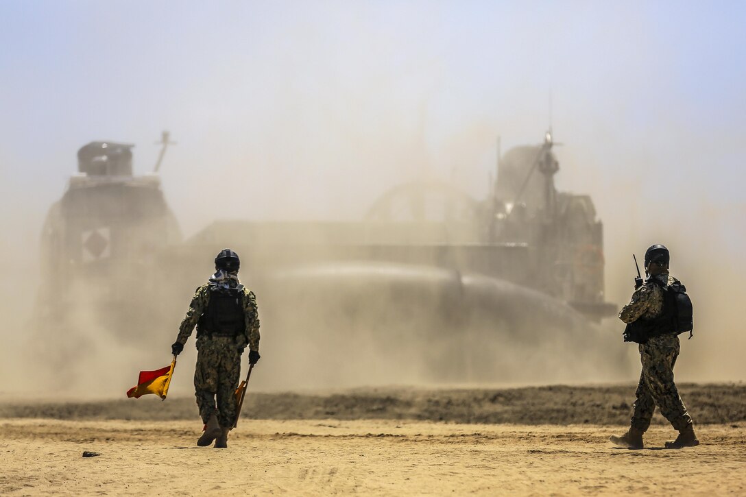 A Navy air-cushion landing craft comes ashore during an amphibious landing demonstration for the U.S. Pacific Command's amphibious leaders symposium on Camp Pendleton, Calif., July 13, 2016. The symposium brings together senior leaders of 22 allied and partner nations from the Indo-Asia-Pacific region. Marine Corps photo by Cpl. Wesley Timm