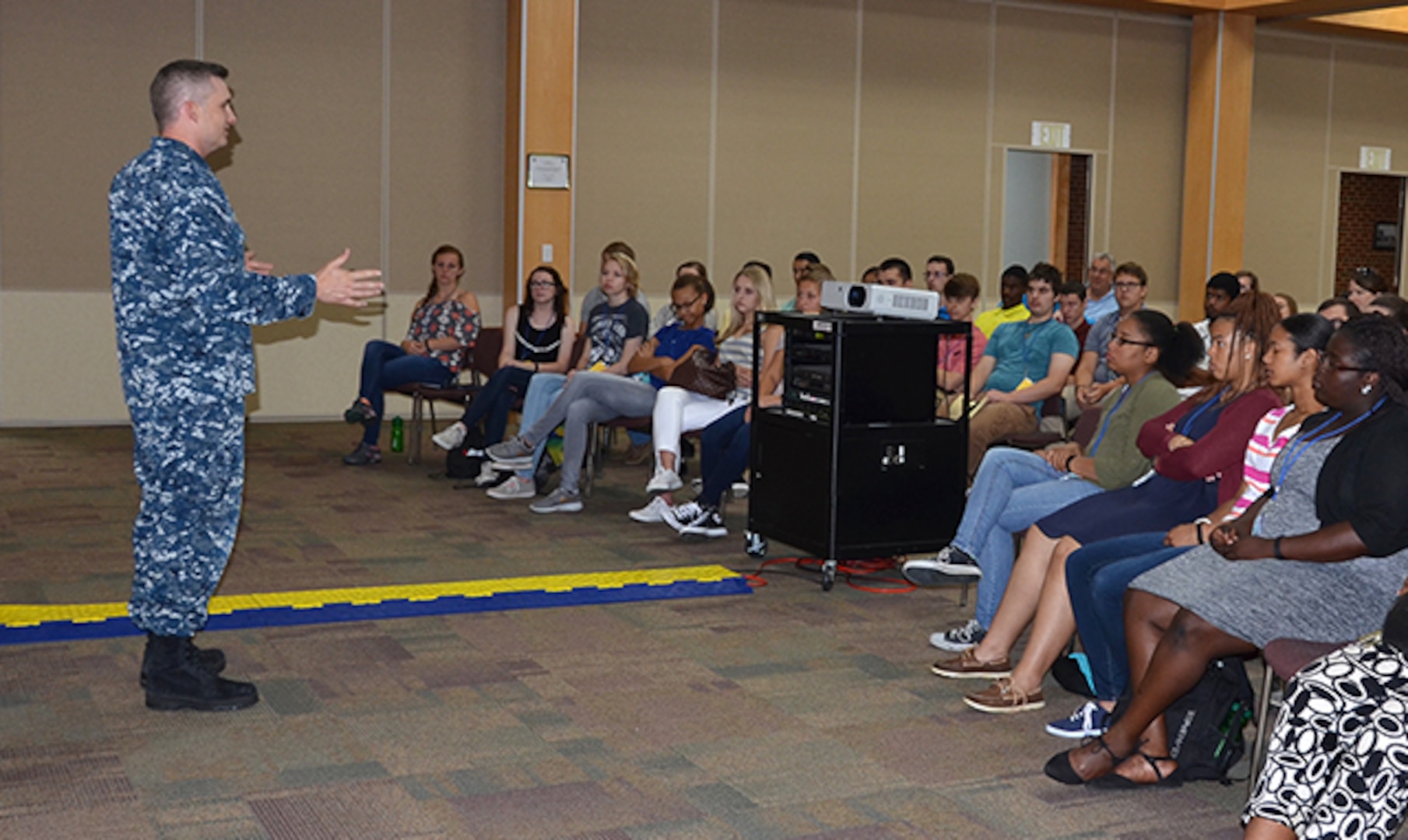 Defense Logistics Agency Aviation's Navy Lt. Cmdr. Ben Nichols speaks to visiting students from the Hanover Regional Governor's School for Career and Technical Advancement on his career path and opportunities his military career has provided. The students visited Defense Supply Center Richmond, Virginia, July 14, 2016, to learn about the various career fields that make up the DLA Aviation and DLA Installation Support at Richmond.