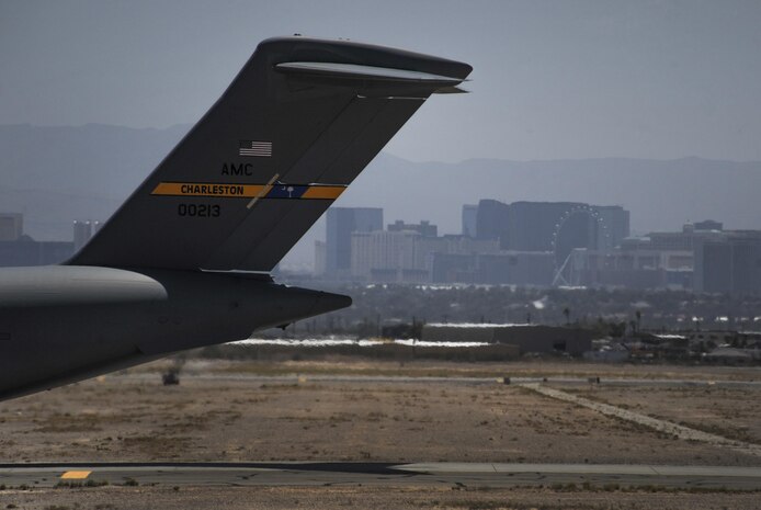 A C-17 Globemaster III, assigned to the 437th Airlift Wing, Joint Base Charleston, S.C. taxis down the runway during the first day of Red Flag 16-3 at Nellis Air Force Base, Nev., July 11, 2016. Red Flag provides an opportunity for aircrew and maintainers the ability to enhance their tactical operational skills alongside military aircraft from coalition forces. (U.S. Air Force photo by Airman 1st Class Kevin Tanenbaum)
