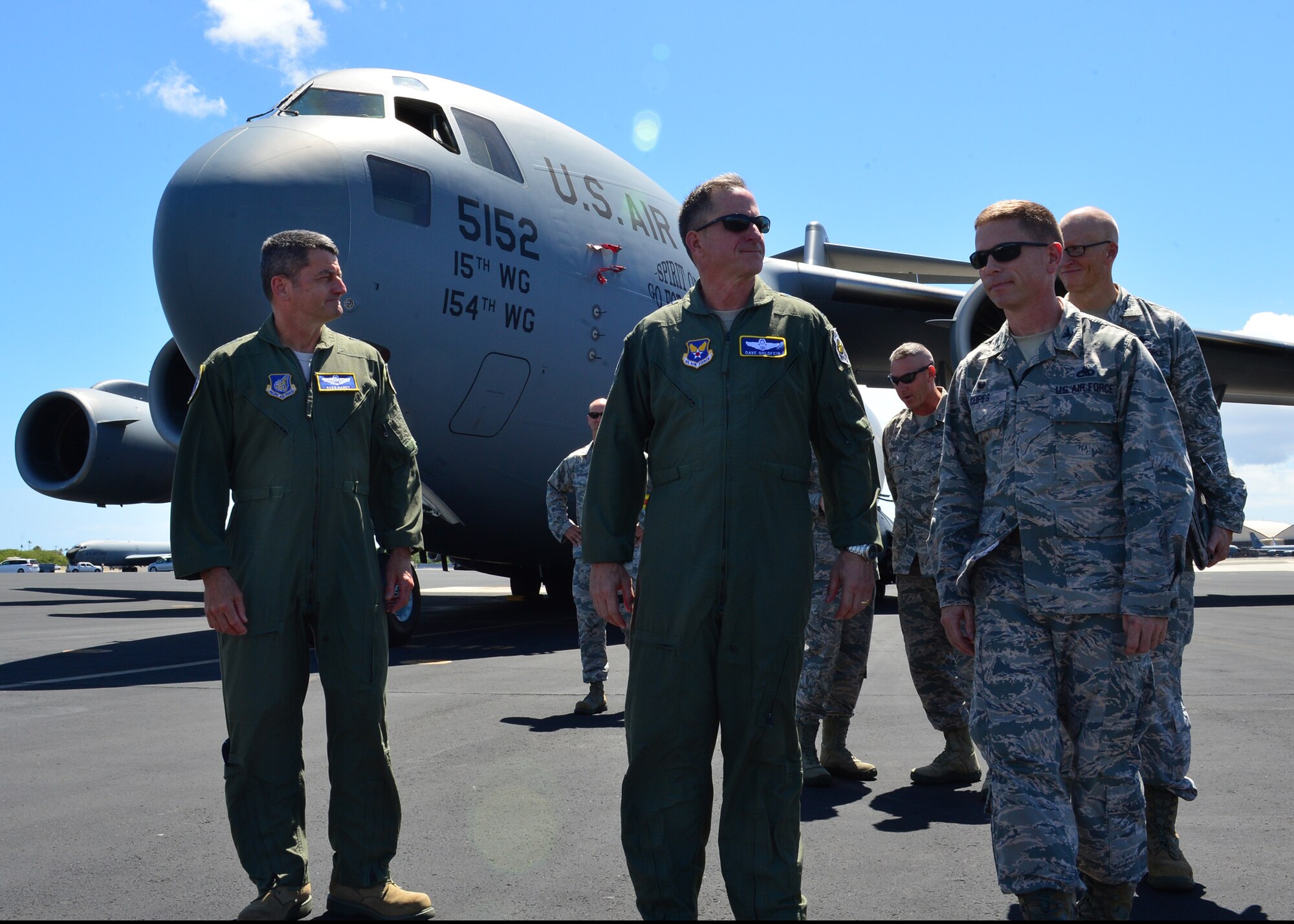 From left, Lt. Gen. Russell Handy, Eleventh Air Force commander, Gen. David L. Goldfein, Chief of Staff of the Air Force, and Col. Robert Copes, commander 15th Maintenance Group, walk away from a C-17 Globemaster III after speaking with Airmen from the 15th Maintenance Group and the Hawaii Air National Guard’s 154th Maintenance Group on Joint Base Pearl Harbor-Hickam, Hawaii, July 12, 2016. Earlier in the day, Goldfein officiated the Pacific Air Forces assumption-of-command ceremony designating Gen. Terrence J. O'Shaughnessy as the commander of PACAF. (U.S. Air Force photo by Tech. Sgt. Aaron Oelrich)  