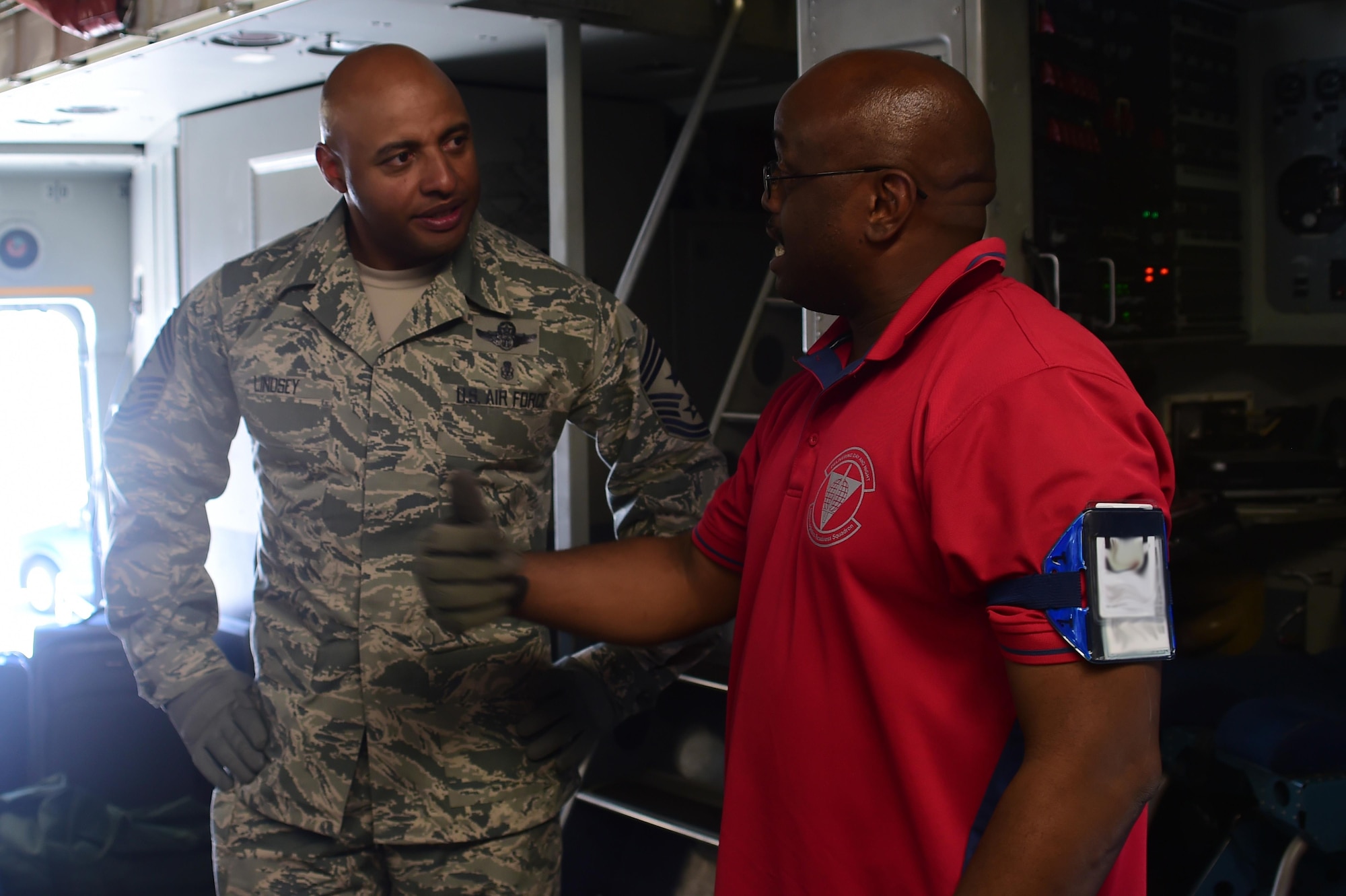 Andrew Mills, 460th Logistics Readiness Squadron airlift operations supervisor, explains his side of the mission to Chief Master Sgt. Rodney Lindsey, 460th Space Wing command chief July 12, 2016, on Buckley Air Force Base, Colo. The 460th LRS works together with the 140th LRS in order to safely load and unload cargo aircraft arriving and departing from Buckley AFB. (U.S. Air Force photo by Airman 1st Class Luke W. Nowakowski/Released)