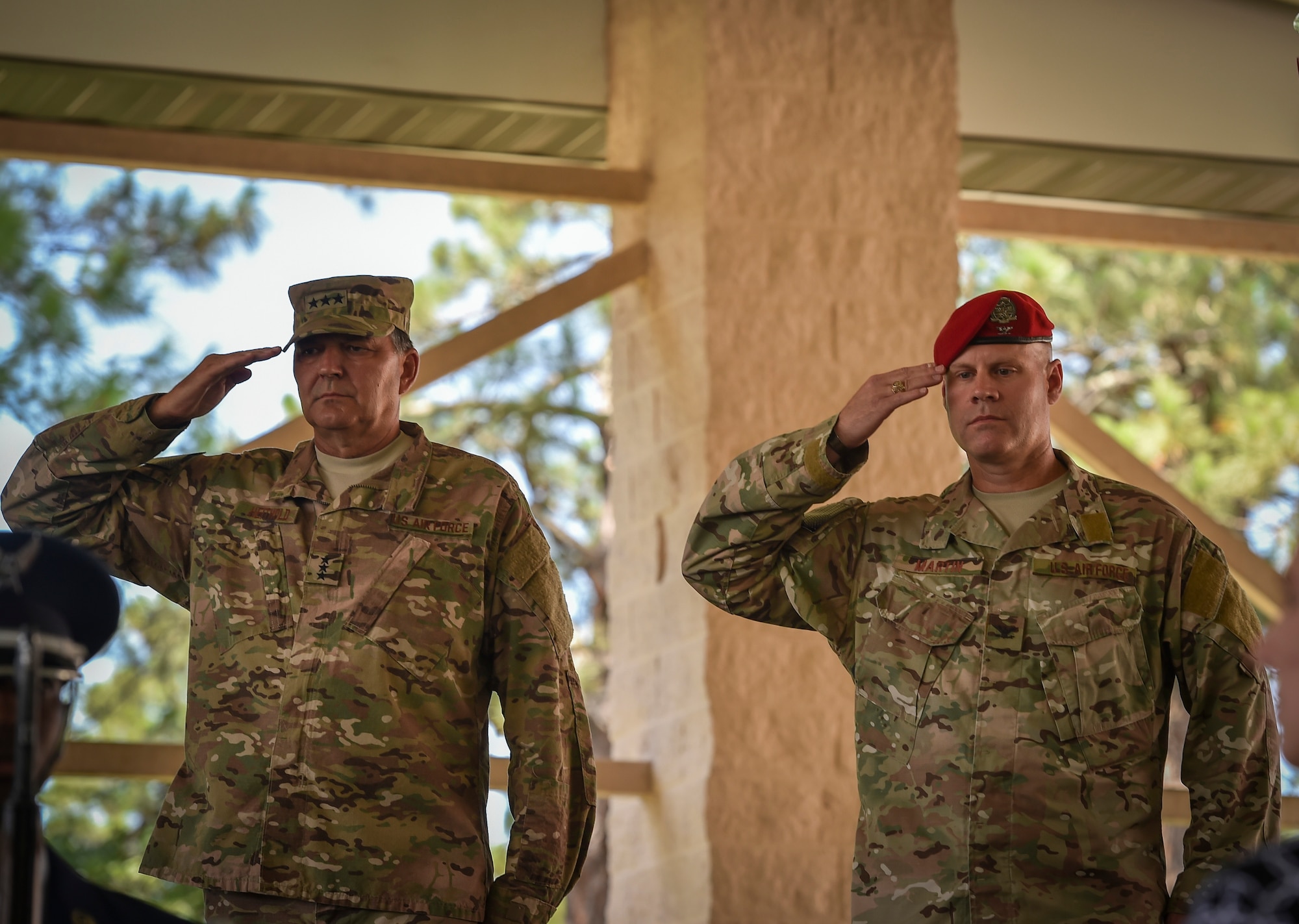 Lt. Gen. Brad Heithold, commander of Air Force Special Operations Command, and Col. Michael Martin, commander of the 24th Special Operations Wing, render a salute during the national anthem at the 24th SOW assumption of command at Hurlburt Field, Fla., July 14, 2016. Heithold presided over the assumption of command, where Martin took command of the sole Special Tactics wing in the Air Force. (U.S. Air Force photo by Senior Airman Ryan Conroy) 