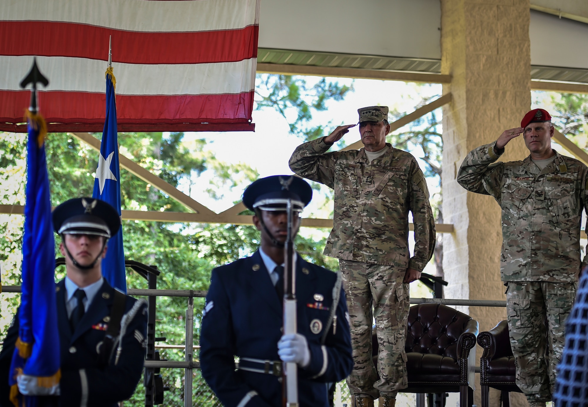 Lt. Gen. Brad Heithold, commander of Air Force Special Operations Command, and Col. Michael Martin, commander of the 24th Special Operations Wing, render a salute during the national anthem at the 24th SOW assumption of command at Hurlburt Field, Fla., July 14, 2016. Heithold presided over the assumption of command, where Martin took command of the sole Special Tactics wing in the Air Force. (U.S. Air Force photo by Senior Airman Ryan Conroy) 