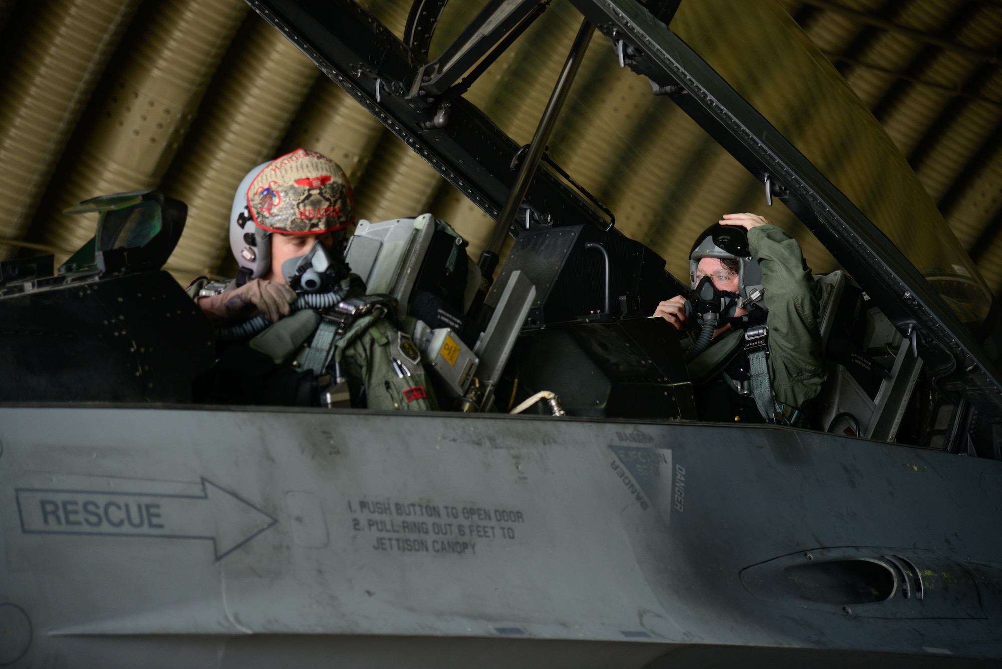 Capt. Scott Martin, 36th Fighter Squadron pilot, gives preflight instructions to Marc Knapper, U.S. Embassy to the Republic of Korea deputy chief of mission, before a familiarization flight in an F-16 Fighting Falcon at Osan Air Base, Republic of Korea, July 14, 2016. Knapper flew in the aircraft to better understand Seventh Air Force’s role in the defense of the ROK as part of United States Forces Korea. (U.S. Air Force photo by Senior Airman Dillian Bamman/Released)