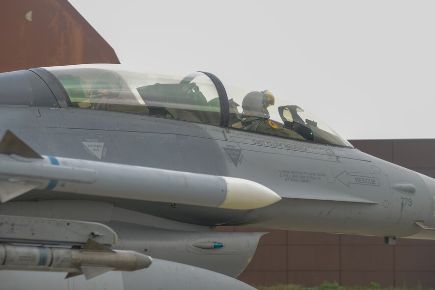 Capt. Scott Martin, 36th Fighter Squadron pilot, and Marc Knapper, U.S. Embassy to the Republic of Korea deputy chief of mission, taxi on the flightline before a familiarization flight in an F-16 Fighting Falcon at Osan Air Base, Republic of Korea, July 14, 2016. Knapper flew in the aircraft to better understand Seventh Air Force’s role in the defense of the ROK as part of United States Forces Korea. (U.S. Air Force photo by Senior Airman Dillian Bamman/Released)