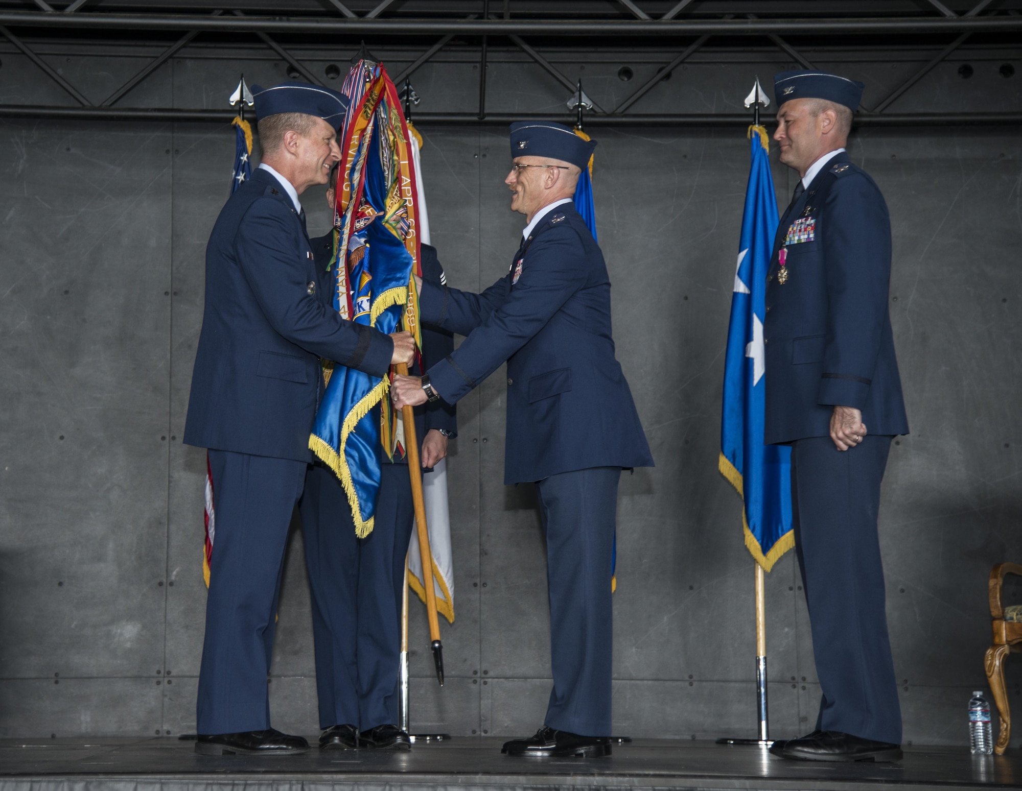 U.S. Air Force Lt. Gen. John L. Dolan, Fifth Air Force commander, left, and Col. R. Scott Jobe, 35th Fighter Wing commander, right, smile for a photo at Misawa Air Base, Japan, July 7, 2016. Airmen gathered to witness Col. Timothy Sundvall, the assistant deputy director of Operations with the Joint Staff J3, relinquish command to Col. R. Scott Jobe, 35th FW commander. (U.S. Air Force photo by Senior Airman Brittany A. Chase)