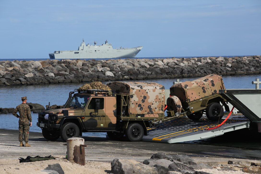 160712-M-UK649-034 KAWAIHAE PIER, Hawaii (July 12, 2016)  – Australian Soldiers with 2nd Battalion, Royal Australian Regiment debark Her Majesty’s Australian Ship Canberra and come ashore at Kawaihae Pier, Hawaii, July 12, 2016, to participate in Rim of the Pacific 2016, a multinational military exercise. Twenty-six nations, 49 ships, six submarines, about 200 aircraft, and 25,000 personnel are participating in RIMPAC 16 from June 29 to Aug. 4 in and around the Hawaiian Islands and Southern California. The world’s largest international maritime exercise, RIMPAC provides a unique training opportunity while fostering and sustaining cooperative relationships between participants critical to ensuring the safety of sea lanes and security on the world’s oceans. RIMPAC 16 is the 25th exercise in the series that began in 1971. (U.S. Marine Corps Photo by Staff Sgt. Jesse R. Stence)