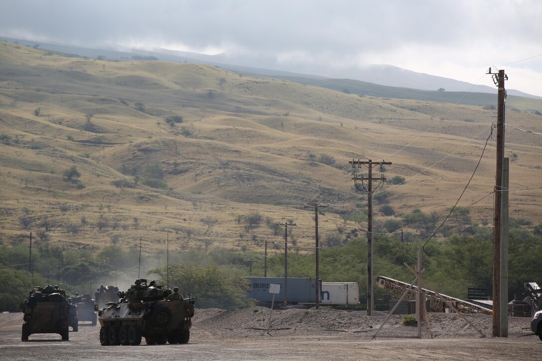 160712-M-UK649-005 KAWAIHAE PIER, Hawaii (July 12, 2016) – After debarking Her Majesty’s Australian Ship Canberra, Soldiers with 2nd Battalion, Royal Australian Regiment convoy toward Pohakuloa Training Area, Hawaii, July 12,2016, to participate in Rim of the Pacific 2016. Twenty-six nations, 49 ships, six submarines, about 200 aircraft, and 25,000 personnel are participating in RIMPAC 16 from June 29 to Aug. 4 in and around the Hawaiian Islands and Southern California. The world’s largest international maritime exercise, RIMPAC provides a unique training opportunity while fostering and sustaining cooperative relationships between participants critical to ensuring the safety of sea lanes and security on the world’s oceans. RIMPAC 16 is the 25th exercise in the series that began in 1971. (U.S. Marine Corps Photo by Staff Sgt. Jesse R. Stence)