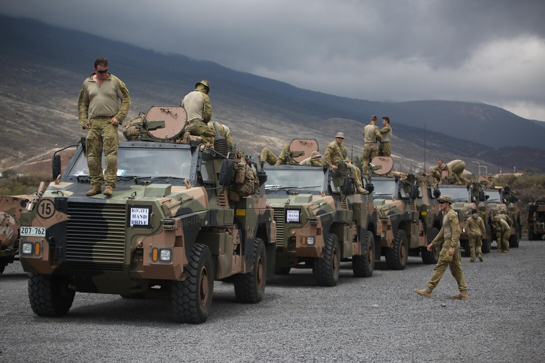 160712-M-UK649-126 POHAKULOA TRAINING AREA, Hawaii (July 12, 2016) – Soldiers with 2nd Battalion, Royal Australian Regiment arrive in Pohakuloa Training Area, Hawaii, after convoying there from Kawaihae Pier, July 12,2016, during Rim of the Pacific 2016. Twenty-six nations, 49 ships, six submarines, about 200 aircraft, and 25,000 personnel are participating in RIMPAC 16 from June 29 to Aug. 4 in and around the Hawaiian Islands and Southern California. The world’s largest international maritime exercise, RIMPAC provides a unique training opportunity while fostering and sustaining cooperative relationships between participants critical to ensuring the safety of sea lanes and security on the world’s oceans. RIMPAC 16 is the 25th exercise in the series that began in 1971. (U.S. Marine Corps Photo by Staff Sgt. Jesse R. Stence)
