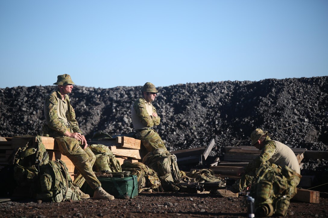 160713-M-UK649-029 POHAKUKLOA TRAINING AREA, Hawaii (July 13, 2016) – Australian Soldiers with 2nd Battalion, Royal Australian Regiment adjust to the arid, high-altitude conditions of Pohakuloa Training Area, Hawaii, before commencing a live fire range, July 13, 2016, during Rim of the Pacific 2016. Twenty-six nations, 49 ships, six submarines, about 200 aircraft, and 25,000 personnel are participating in RIMPAC 16 from June 29 to Aug. 4 in and around the Hawaiian Islands and Southern California. The world’s largest international maritime exercise, RIMPAC provides a unique training opportunity while fostering and sustaining cooperative relationships between participants critical to ensuring the safety of sea lanes and security on the world’s oceans. RIMPAC 16 is the 25th exercise in the series that began in 1971. (U.S. Marine Corps Photo by Staff Sgt. Jesse R. Stence)