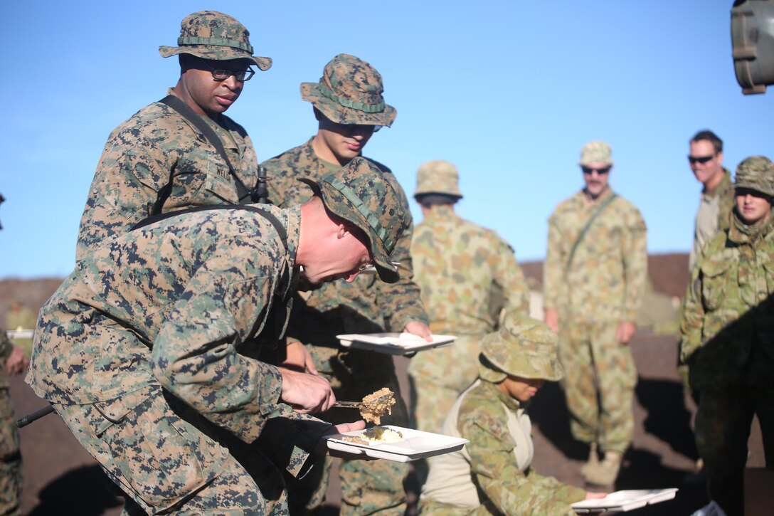 160713-M-UK649-046 POHAKULOA TRAINING AREA, Hawaii (July 13, 2016) – U.S. Marines enjoy field oatmeal along with an assortment of expeditionary cuisine in Pohakuloa Training Area, Hawaii, July 13, 2016, while encamped with 2nd Battalion, Royal Australian Regiment during Rim of the Pacific 2016. Twenty-six nations, 49 ships, six submarines, about 200 aircraft, and 25,000 personnel are participating in RIMPAC 16 from June 29 to Aug. 4 in and around the Hawaiian Islands and Southern California. The world’s largest international maritime exercise, RIMPAC provides a unique training opportunity while fostering and sustaining cooperative relationships between participants critical to ensuring the safety of sea lanes and security on the world’s oceans.  The Marines are with 2nd Battalion, 3rd Marine Regiment, which supports III Marine Expeditionary Force. (U.S. Marine Corps Photo by Staff Sgt. Jesse R. Stence)