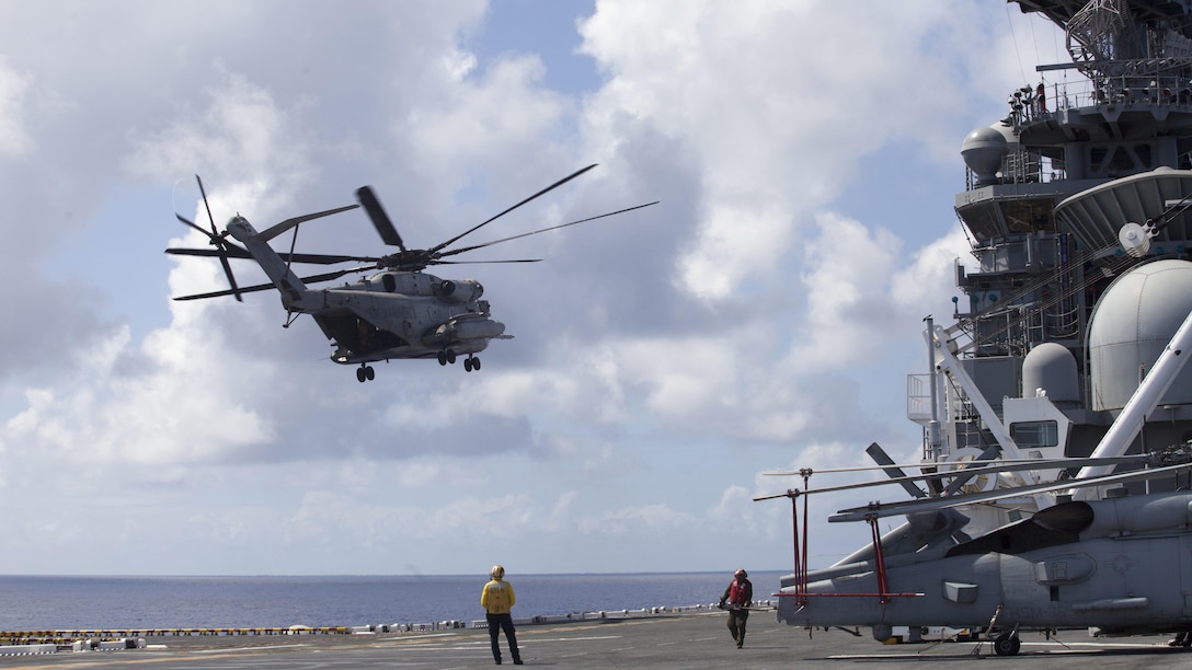 A Super Stallion CH-53E helicopter takes off from the USS America July 12, 2016 during deck landing qualifications and initial arrival. Marine Heavy Helicopter Squadron 463 (reinforced) will operate the aircraft from the USS America as the Aviation Combat Element for Provisional Marine Expeditionary Brigade-Hawaii during RIMPAC. Twenty-six nations, 49 ships, six submarines, about 200 aircraft, and 25,000 personnel are participating in RIMPAC 2016 from June 29 to Aug. 4 in and around the Hawaiian Islands and southern California. The world's largest international maritime exercise, RIMPAC provides a unique training opportunity while fostering and sustaining cooperative relationships participants critical to ensuring the safety of sea lanes and security on the world's oceans.