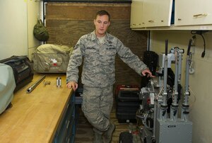Tech. Sgt. Anthony Sennhenn, noncommissioned officer in charge of the 628th Civil Engineer Squadron Flight, Explosive Ordnance Disposal flight, explains various tools EOD uses to safely dispose of explosive devices. EOD Airmen serve as the Air Force’s bomb squad and are trained to detect, disarm, detonate and dispose of explosive threats all over the world. (U.S. Air Force photo/Airman 1st Class Kevin West)