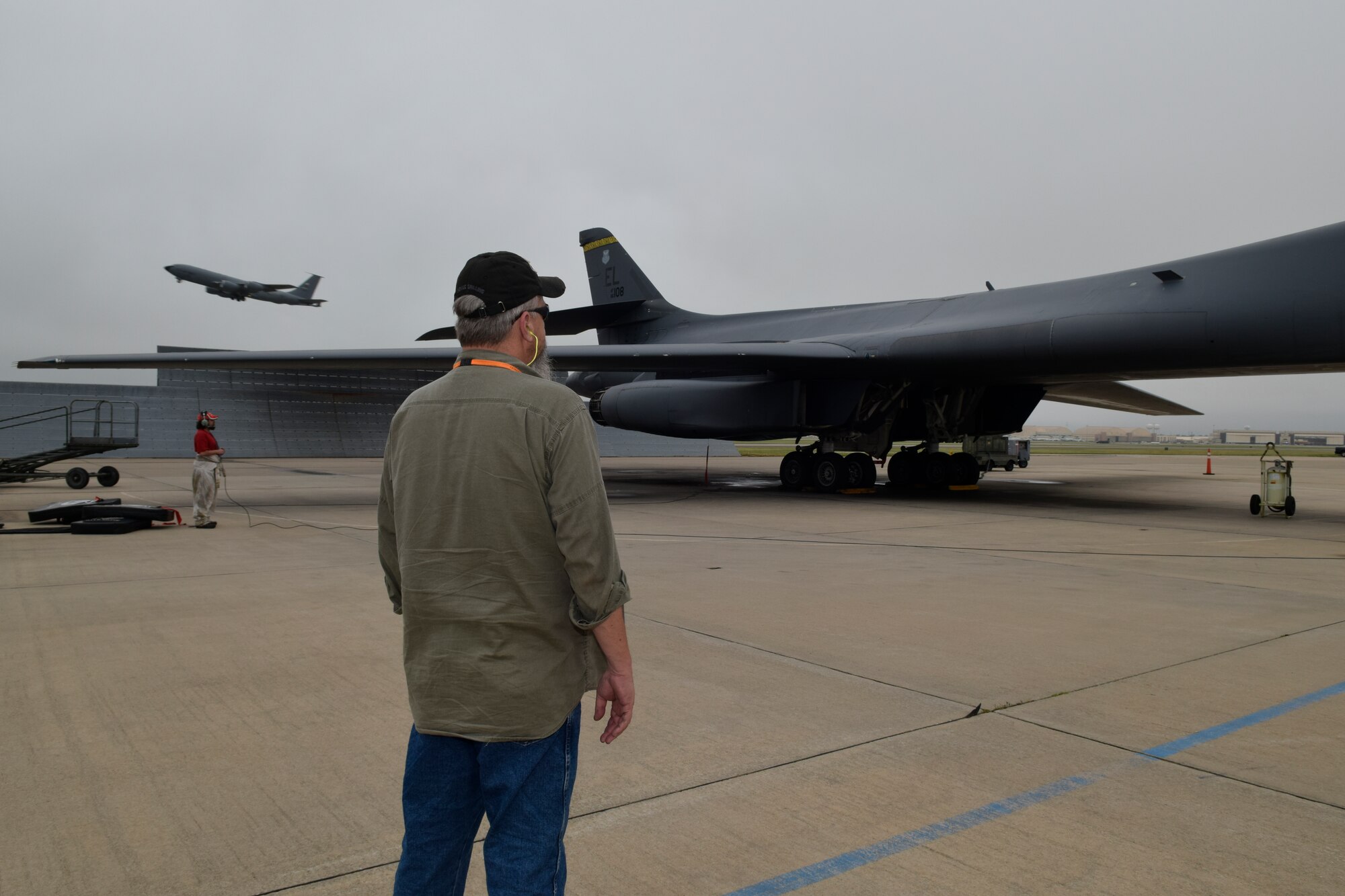 Randy Miller, Oklahoma City Air Logistics Complex quality assurance inspector, stands on the Tinker Air Force Base flight line while monitoring engin-run tests of a B-1B Lancer during functional tests June 13, 2016, Tinker AFB, Okla. Miller has QA inspection and oversight duties for bomber and E-3 aircraft undergoing work at OC-ALC. (U.S. Air Force photo/Greg L. Davis)