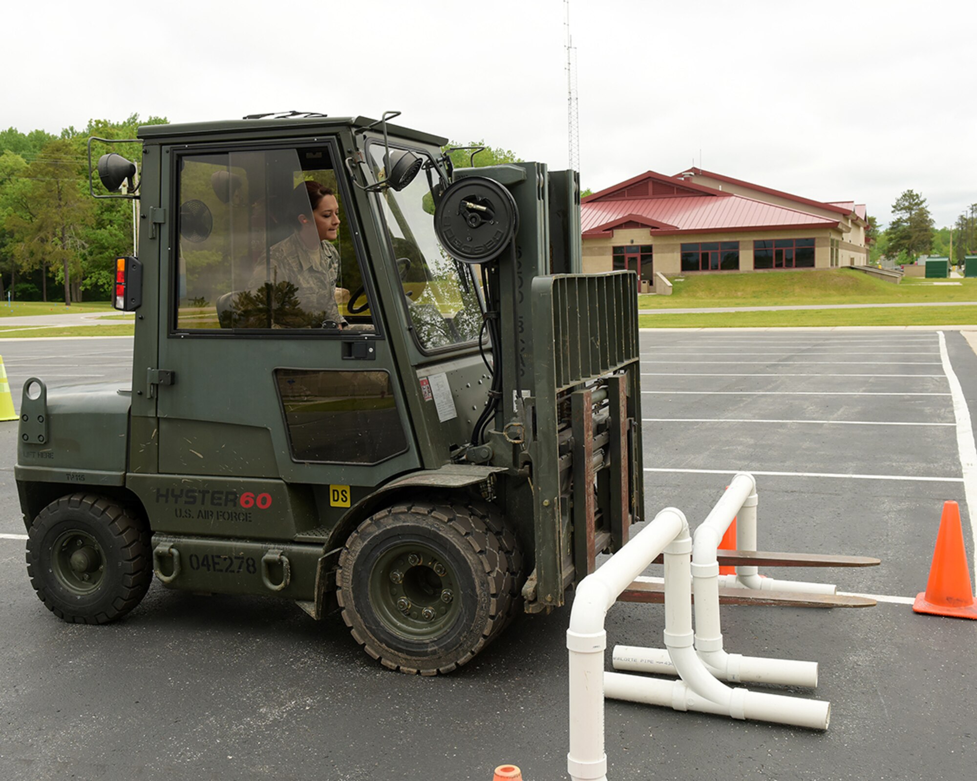 Ohio Air National Guard Staff Sgt. Brittany Schirtzinger, 178th Logistics Readiness Squadron, operates a forklift June 7, 2016, at Alpena Combat Readiness Training Center, Alpena Michigan.  Schirtzinger operated the forklift as part of a material handling equipment refresher class during the 178th wing annual training. (Ohio Air National Guard Photo by Master Sgt. Seth Skidmore)