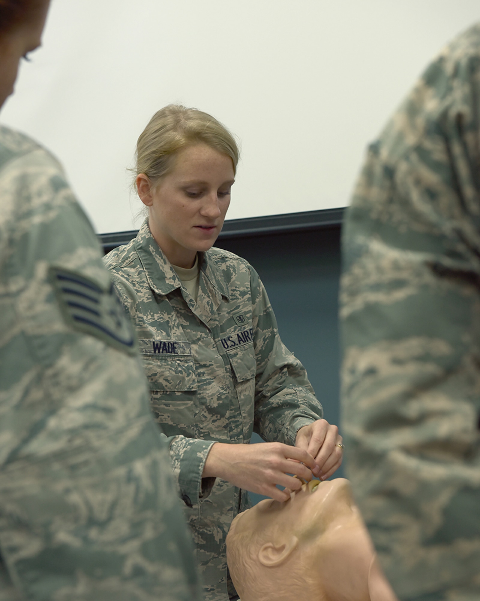 Ohio Air National Guard Senior Airman Katie Wade, 178th Medical Group, teaches a class on airway management during Self-Aid Buddy Care June 6, 2016, at Alpena Combat Readiness Training Center, Alpena Michigan.  Wade taught the SABC course as part of an annual training rodeo for the 178th Force Support Squadron during the 178th Wing annual training. (Ohio Air National Guard Photo by Master Sgt. Seth Skidmore)